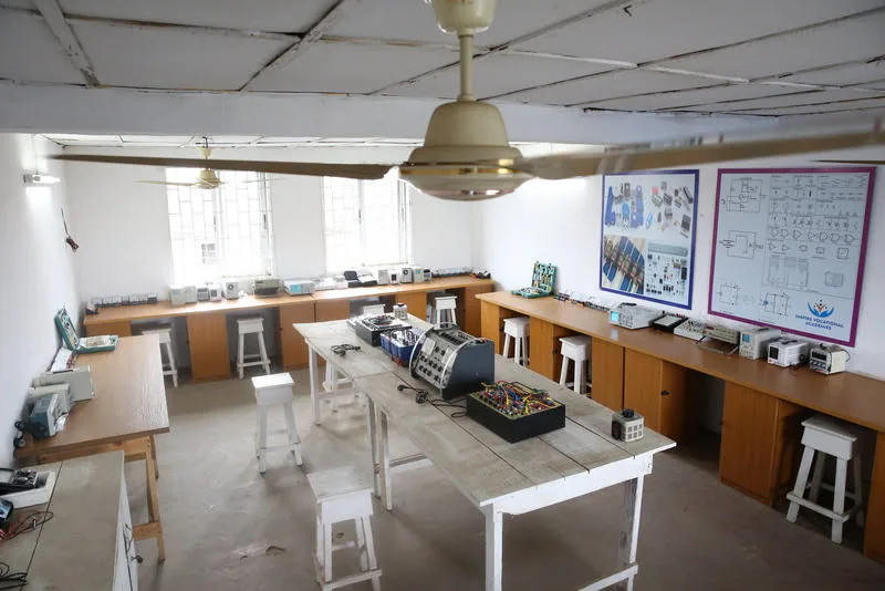 An electronics practical room and its workbenches.