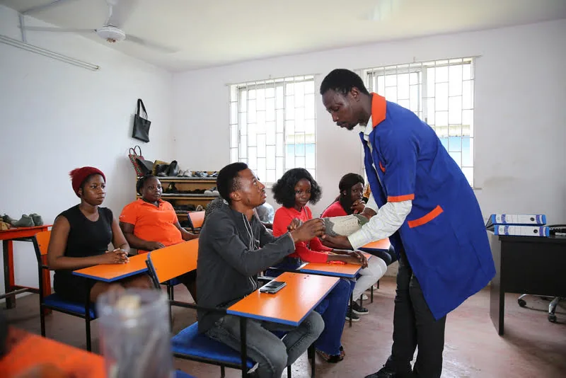An instructor and learners in a practical session